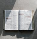 White Book Page on Gray Textile