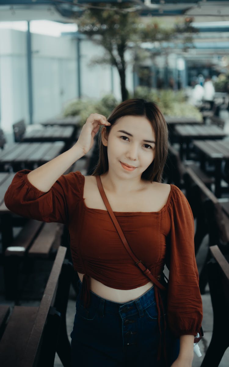 Portrait Of Woman Standing Between Rows Of Empty Tables