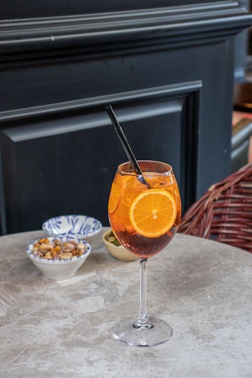 Refreshing Drink with Orange Slices and Ice Cubes