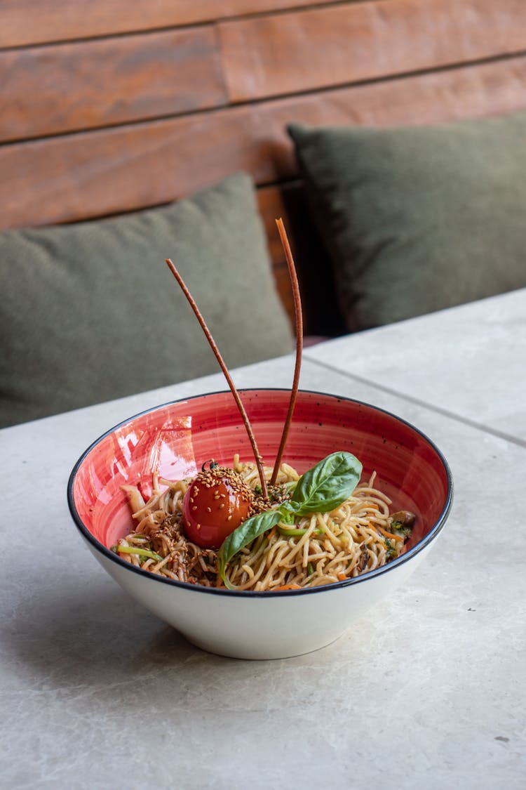 Pasta With Tomato Sauce Decorated With Fresh Basil Leaves And Tomato 