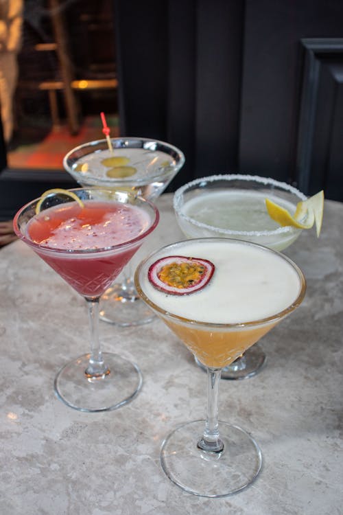 Free Assorted Cocktails on a Marble Surface Stock Photo