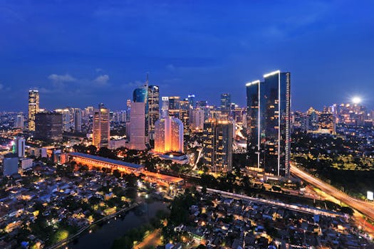 Stunning view of Jakarta's illuminated skyline at night, showcasing modern skyscrapers and vibrant urban life.