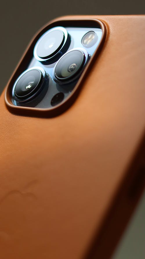 A Close-up Shot of an Iphone with Brown Leather Case