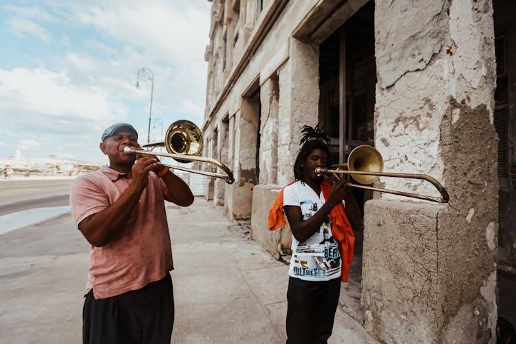 Two People Playing Trombone