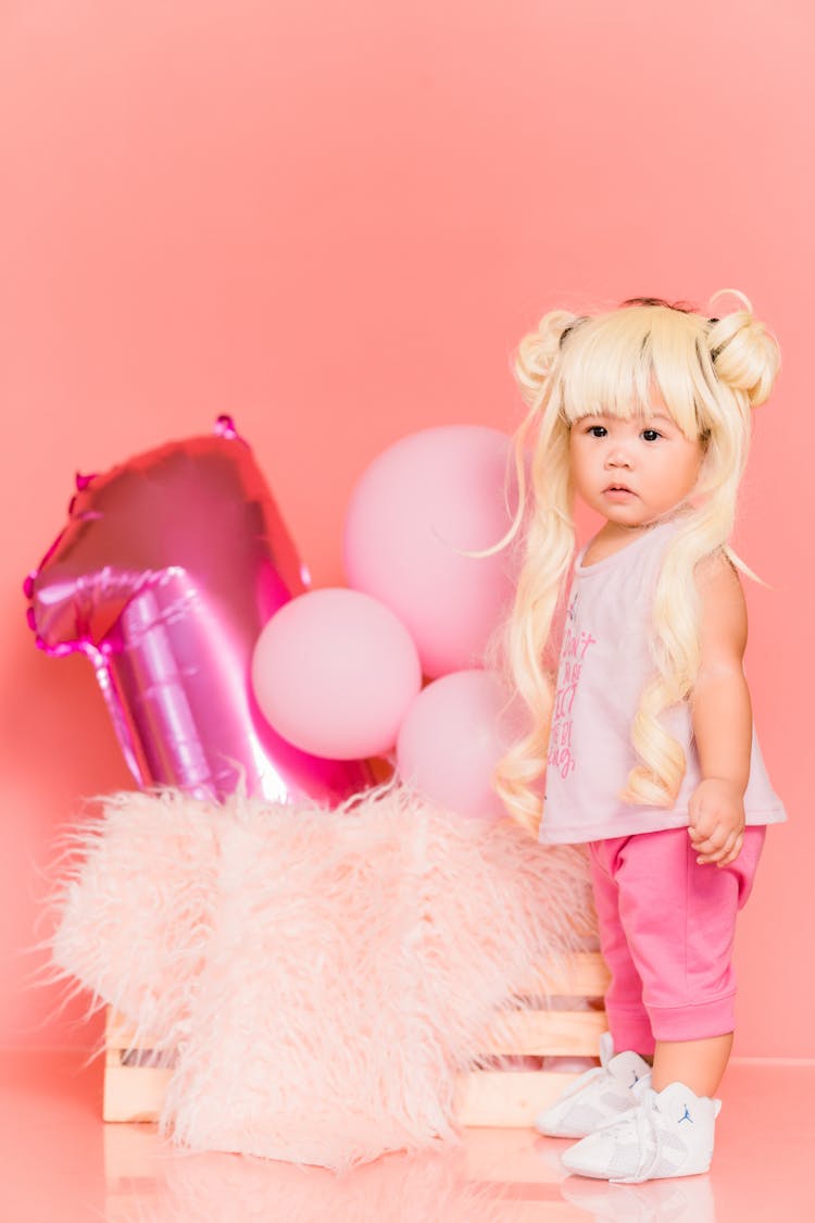 Little Girl In A Wig Celebrating 1st Birthday 