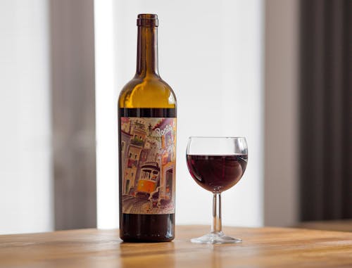 A Glass of Wine on a Wooden Surface 