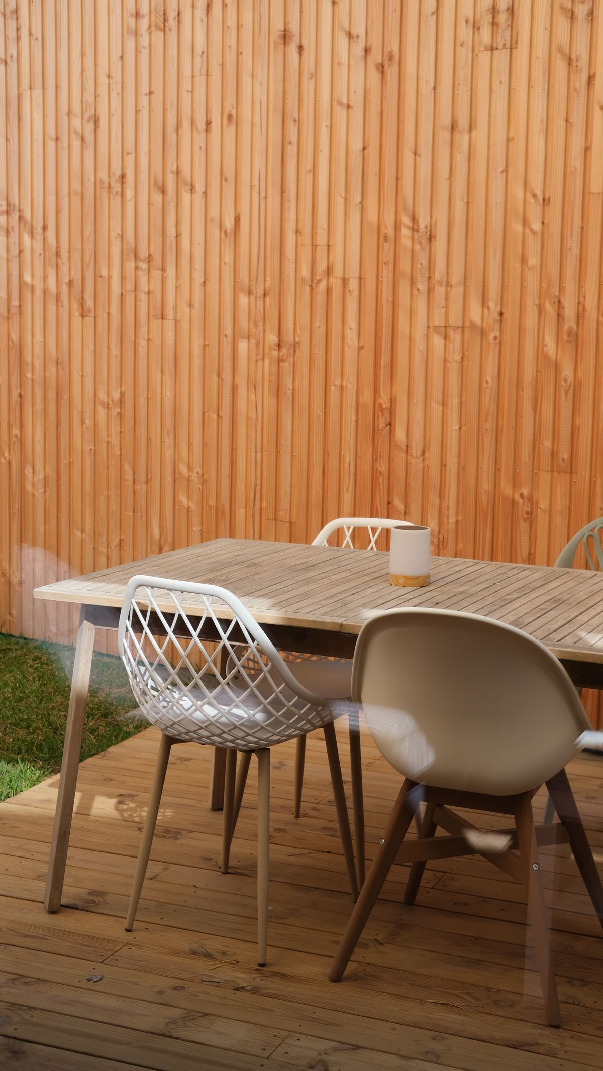 Outdoor patio with new wood fencing and dining area