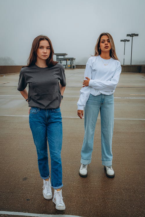 Two beautiful Women Standing on Roof Top