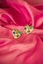 Heart Shaped Jewllery on Pink Background