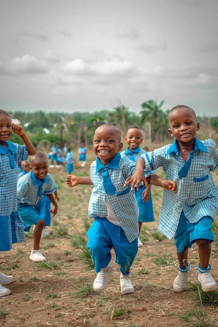 Boys In Blue Uniform Running