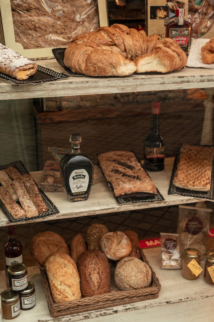 Bread On Brown Wooden Shelf