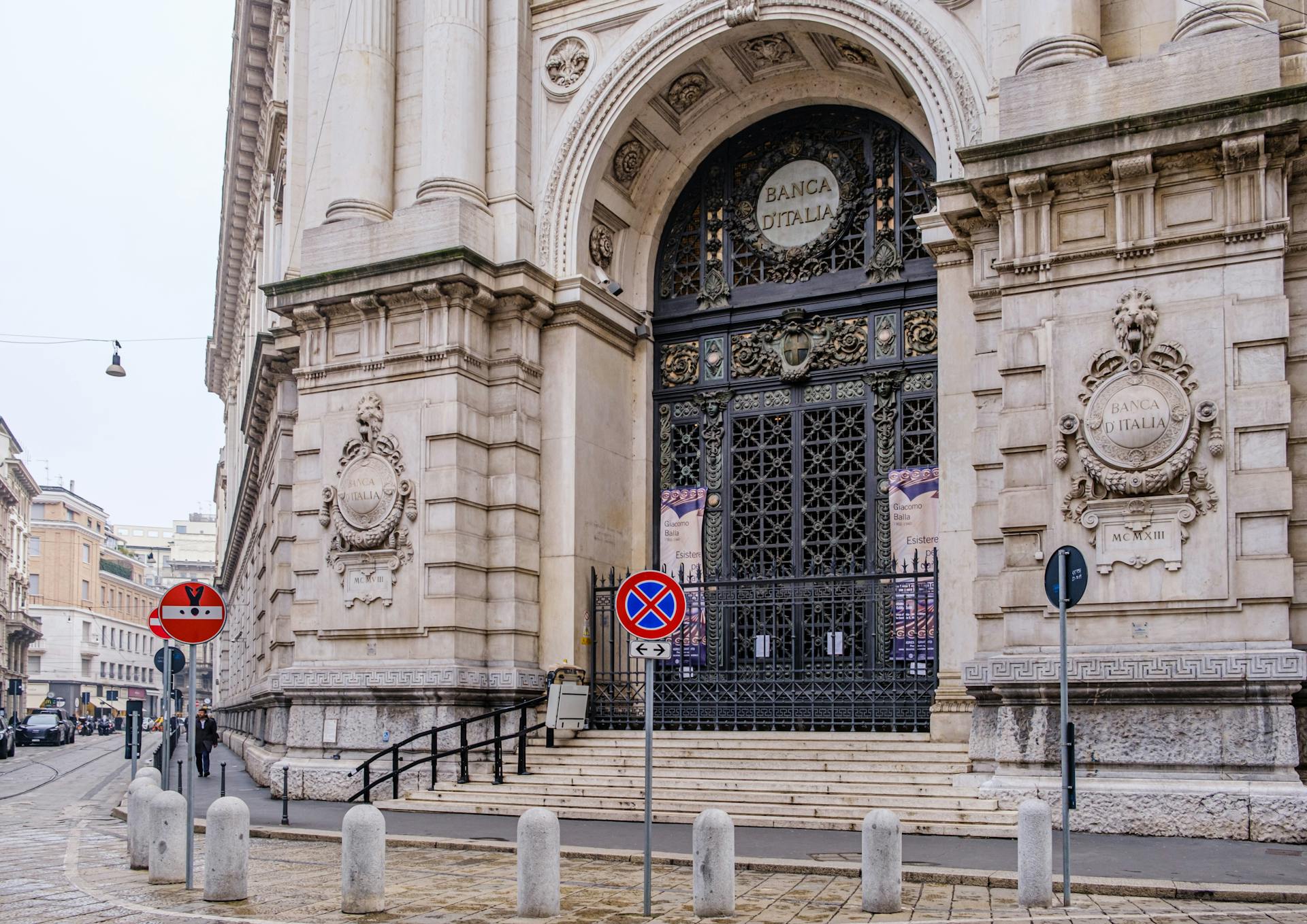 Explore the grand entrance of Banca d'Italia in Milan. Iconic architecture and rich history.