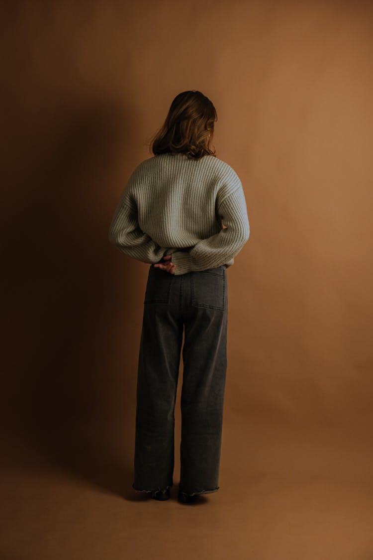 Back View Of Woman In Baggy Clothes