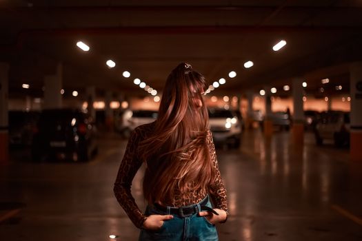 Woman in Animal Print Shirt and Blue Denim Jeans Standing on Hallway