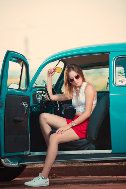 Free Woman Sitting on the Driver Seat of a Car Stock Photo