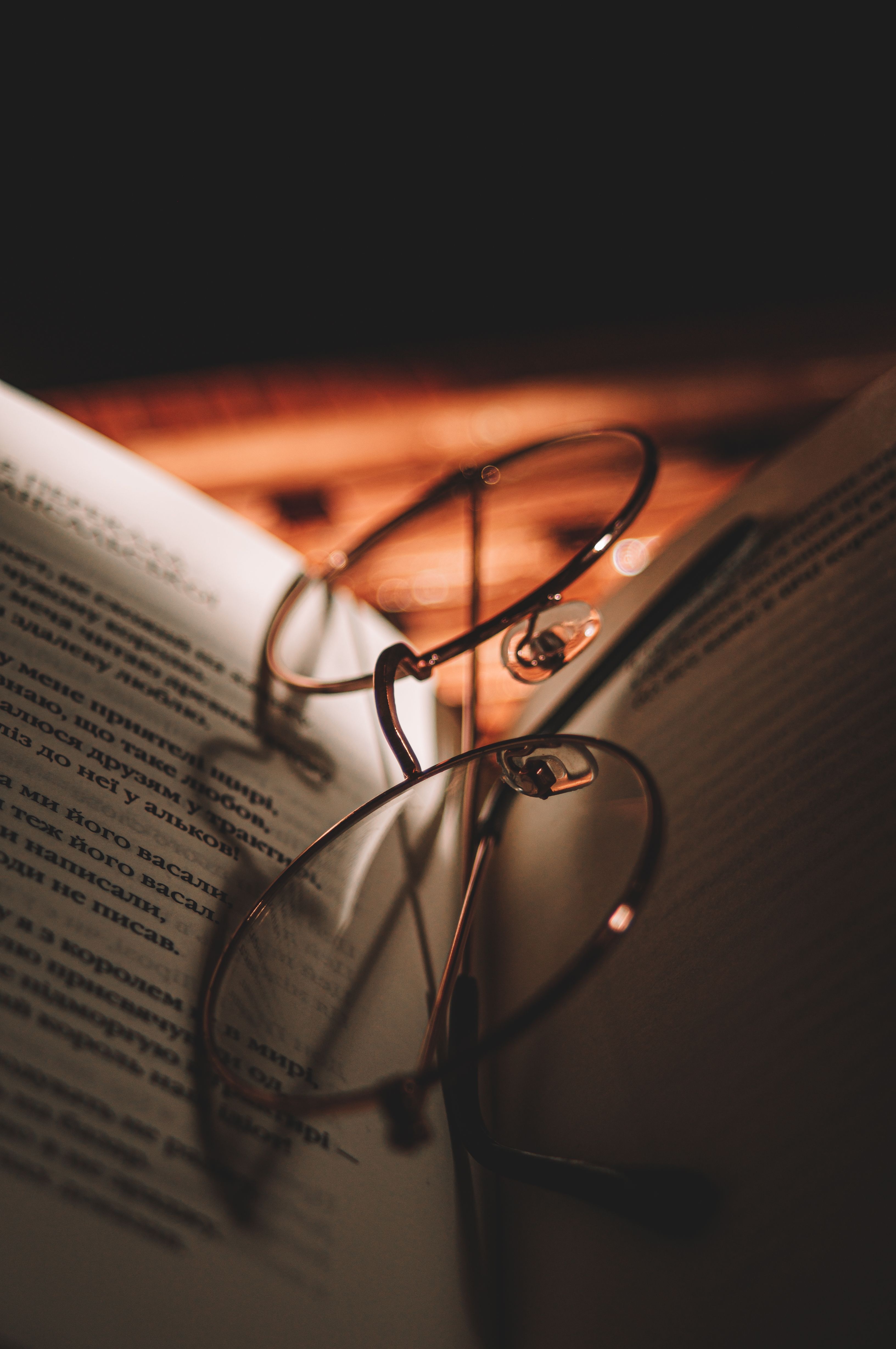 Eyeglasses in Between Pages of a Book · Free Stock Photo