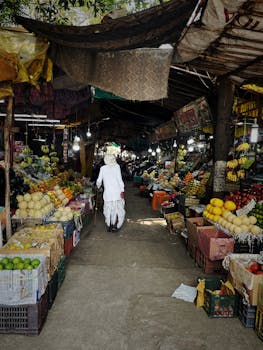 Explore a bustling fruit market in Nashik, India, showcasing fresh produce and vibrant colors.