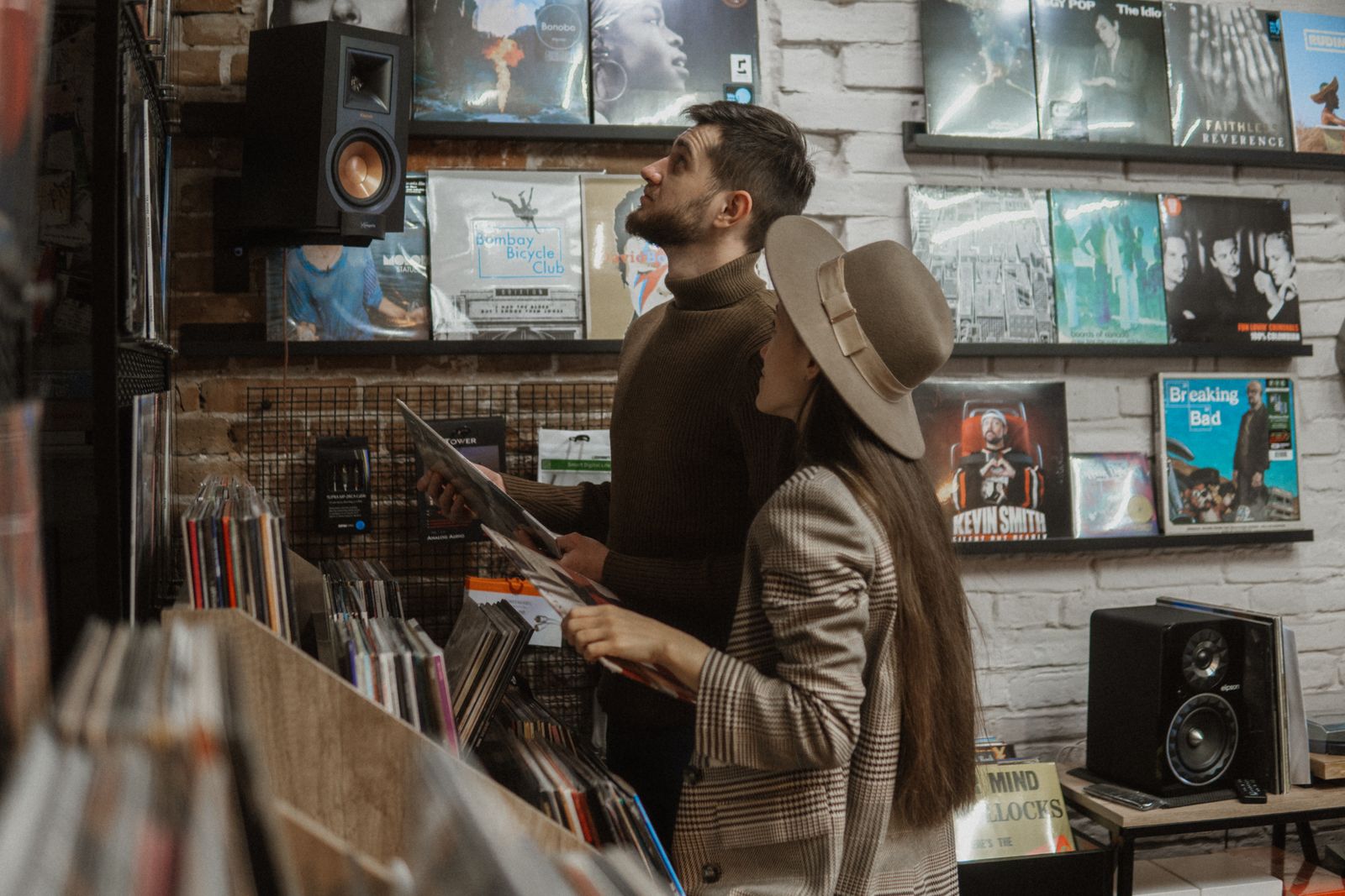 Two people looking through records in a music shop