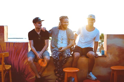 Free Three Men Sitting on Veranda Stock Photo