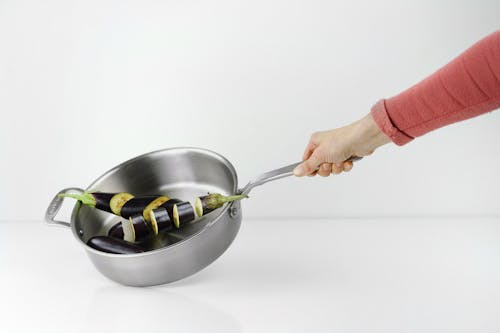 Free Person Holding Stainless Steel Casserole Stock Photo