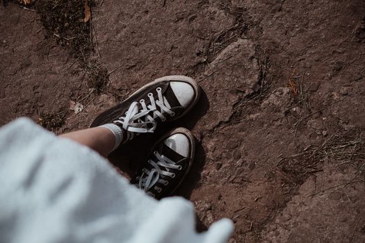 Person Wearing Black and White Sneakers