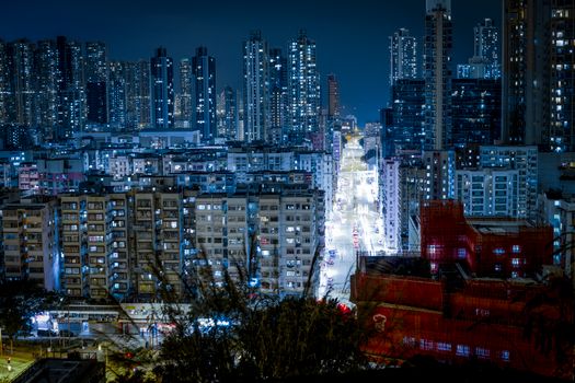 Stunning view of Hong Kong's illuminated high-rise skyline at night, showcasing urban vibrancy.