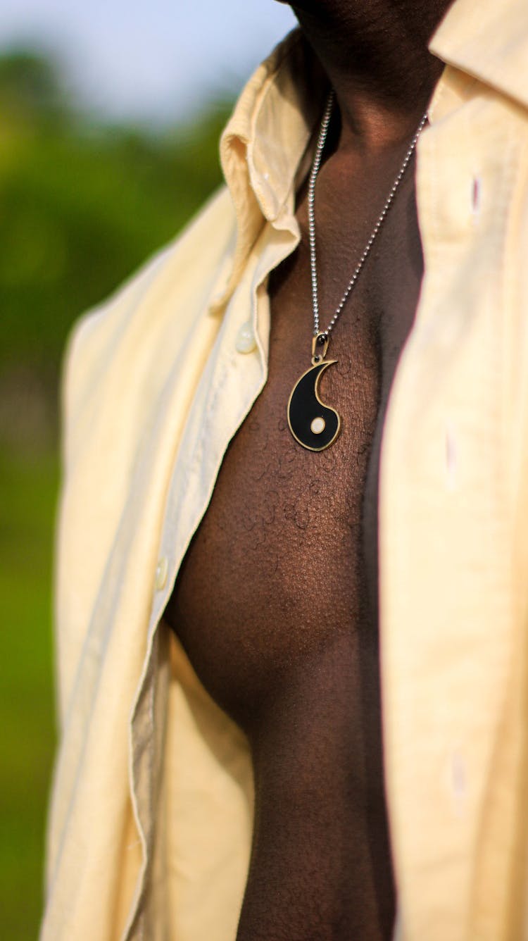 A Person With A Black Necklace