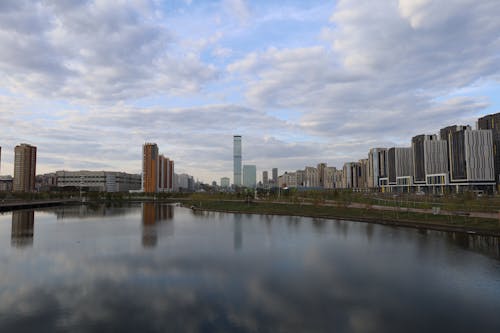 City Buildings Under the Cloudy Sky 