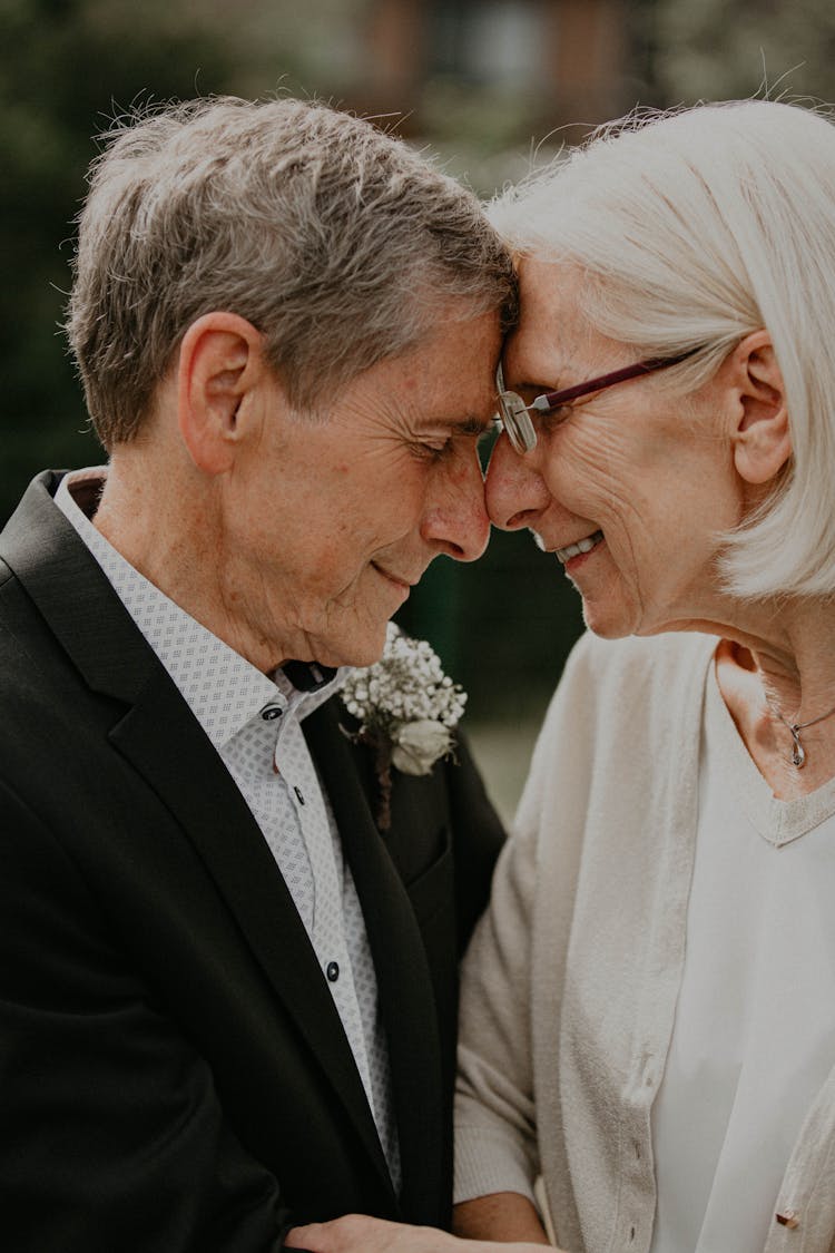 Portrait Of Elderly Couple Touching Foreheads