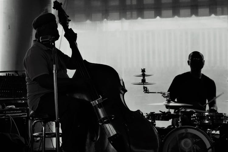 Grayscale Photo Of A Jazz Band Playing Live Music