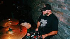 A Man Playing Drums