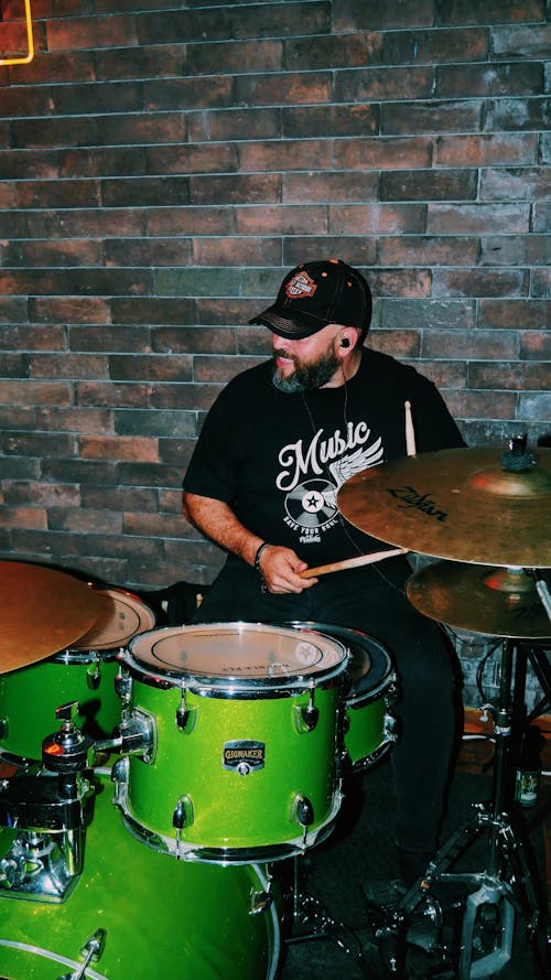 Free A Man Playing the Drums Stock Photo