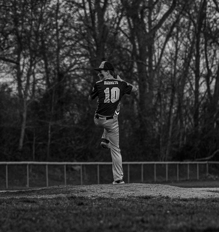 Grayscale Photo Of A Man Playing Baseball