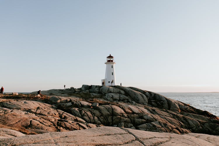 Peggy S Cove Lighthouse On Rock Formation