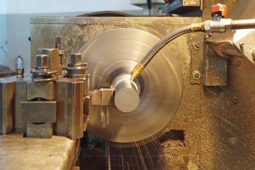 A Water Washing a Round Steel Machine 