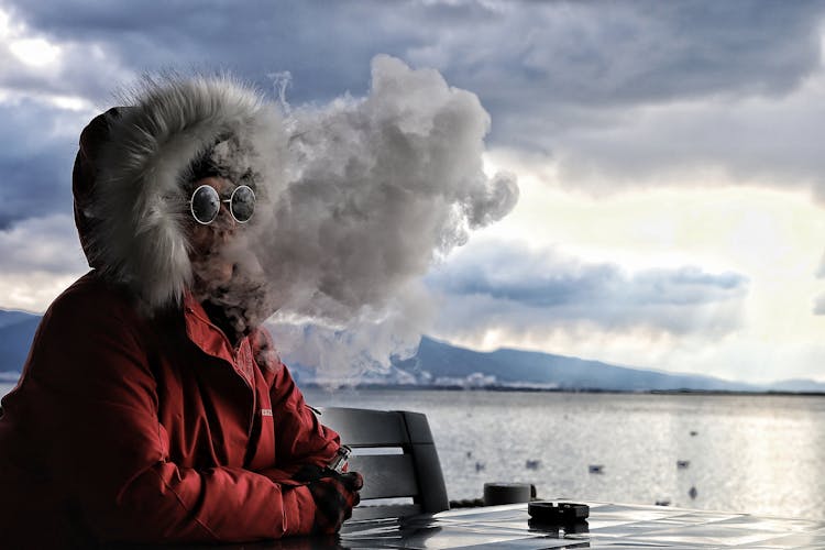 Person Blowing Smoke