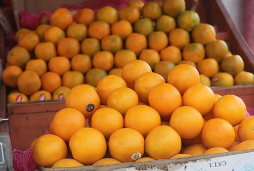 Fresh Orange Fruits on the Wooden Crate