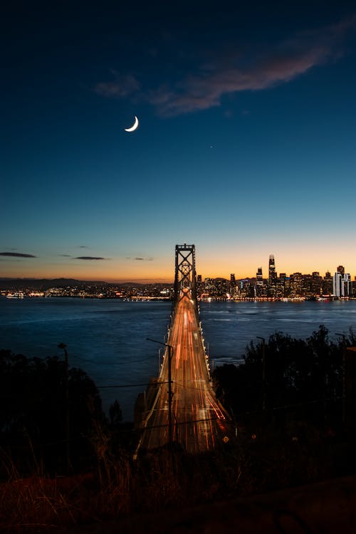 Free Crescent Moon Over Bay Bridge Stock Photo