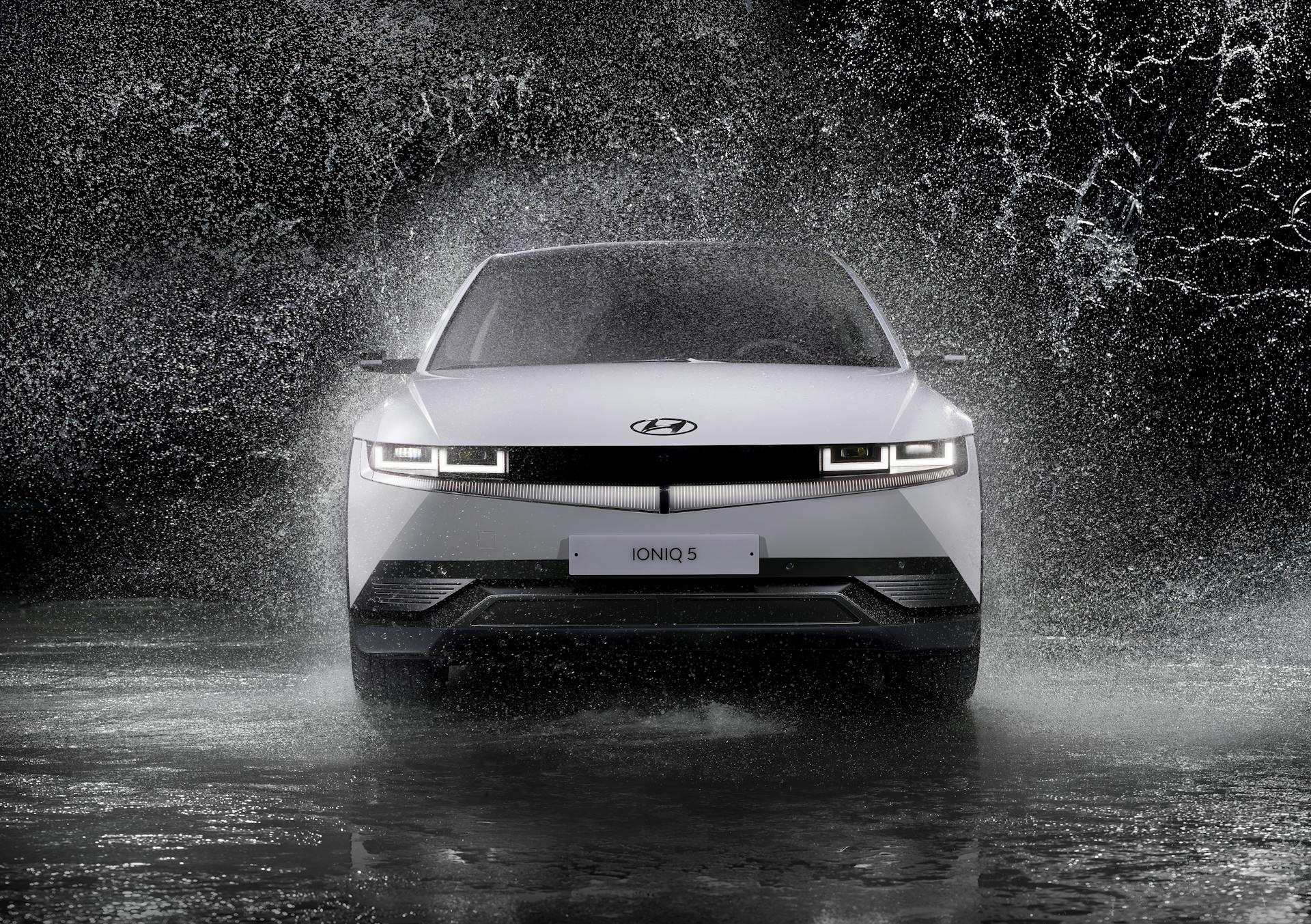 Grayscale Photo of a Hyundai Ioniq 5 in the Rain