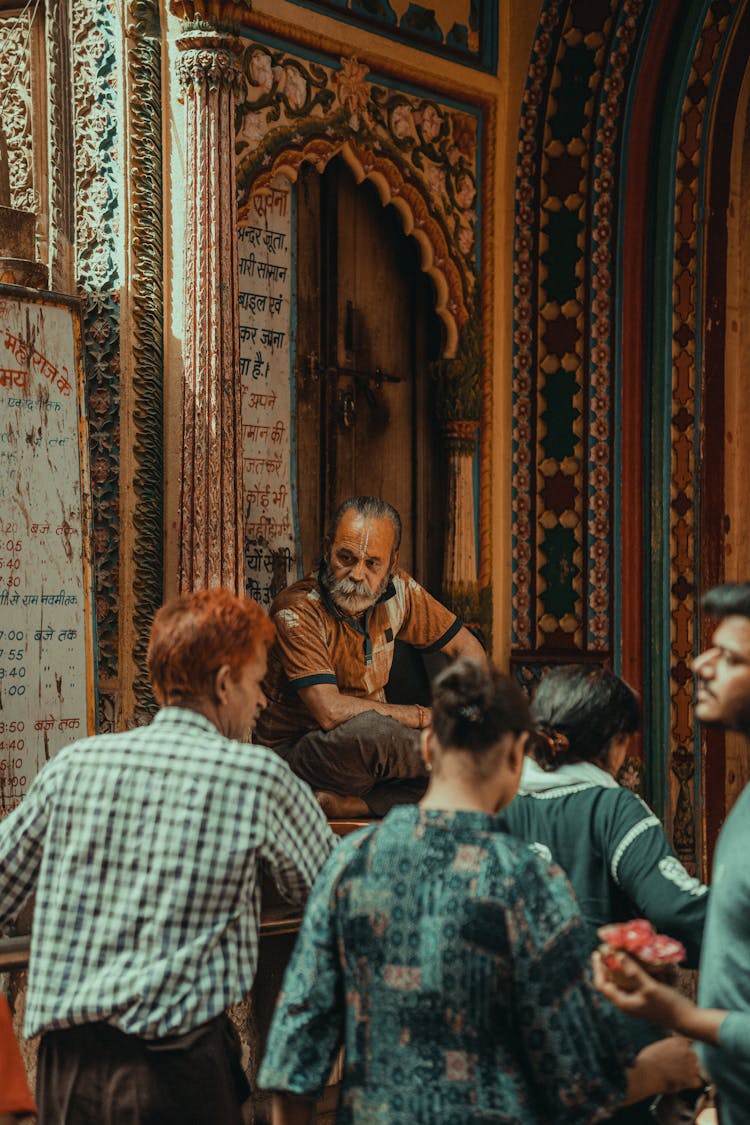 People Near Ornate Traditional Building