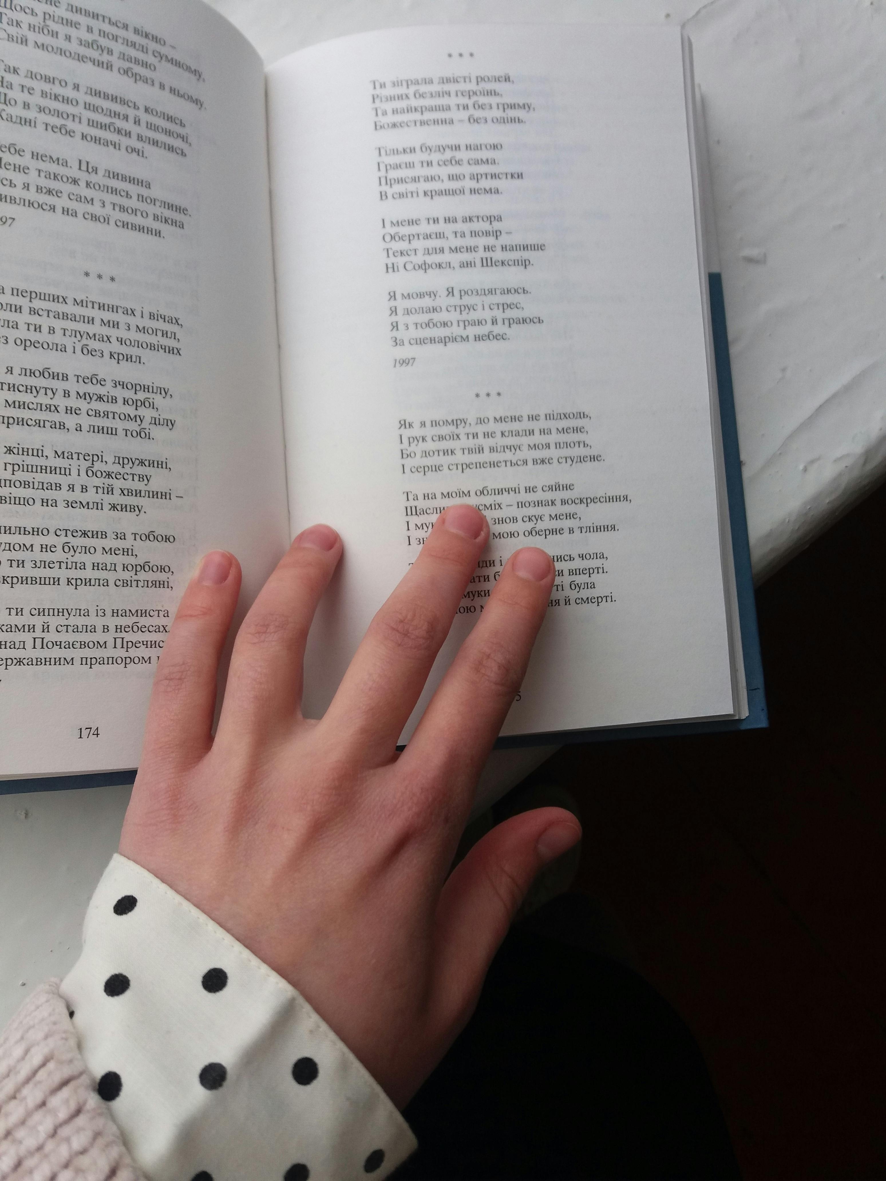 a hand on a book