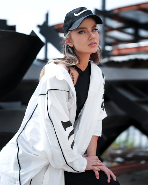 A Beautiful Woman Wearing a Black Nike Cap