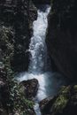 Water Falls Between Rocky Mountain