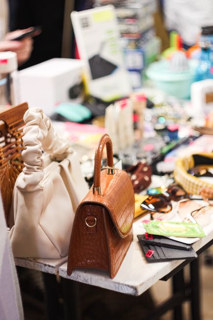 Chic handbags on a table in Saint Petersburg, showcasing modern style and design. - DIY Handbag Care Solutions