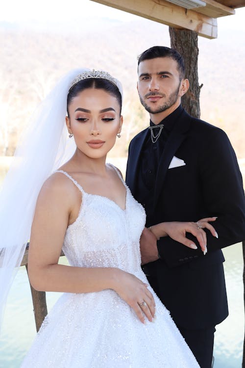 Bride and Groom standing beside each other 