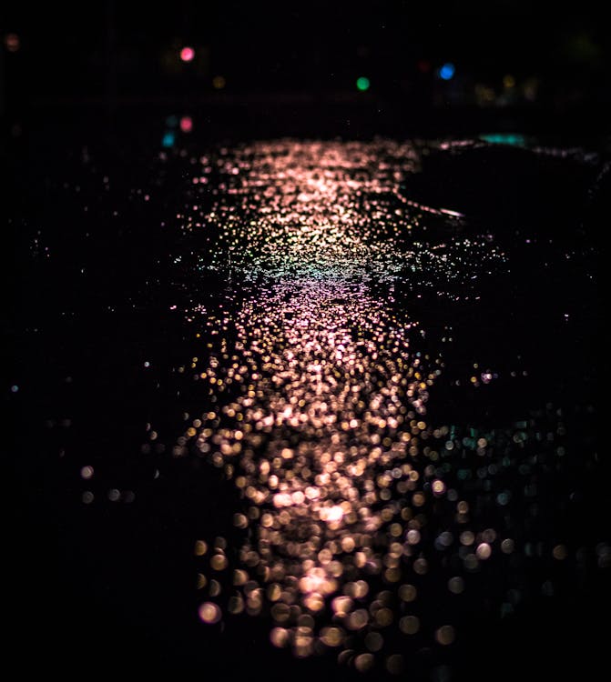 Free Light Reflecting from Wet Pavement Stock Photo