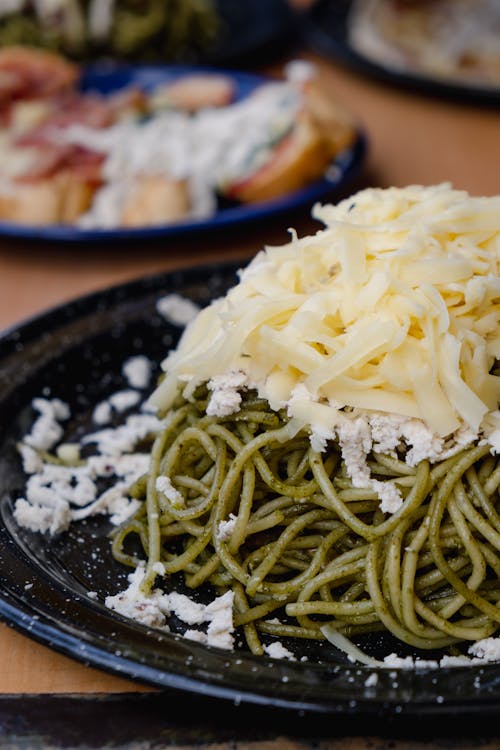 Close Up Photo of Pasta on Black Plate