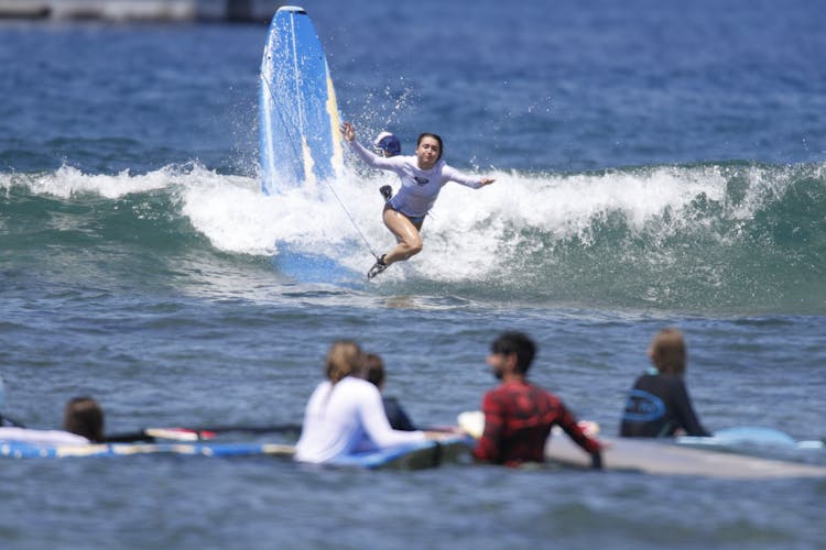 Woman Falling From A Surfboard 