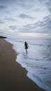 Woman Walking Ankle Deep in Water in Sea