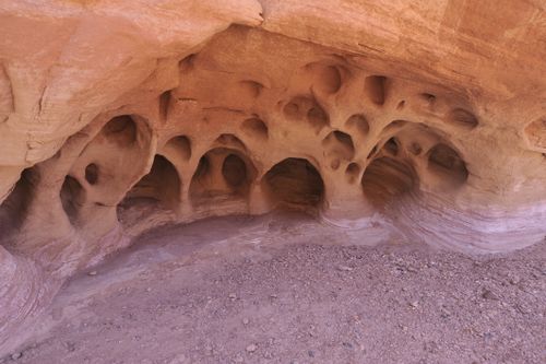 Free A close-up view of intricate sandstone cavern formations showcasing erosion effects and geological features. Stock Photo